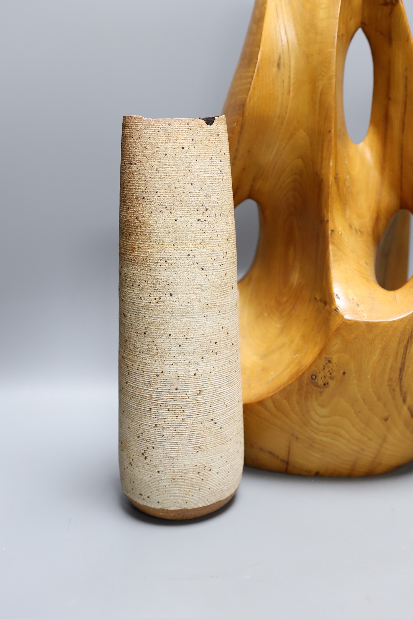 A carved elm abstract sculpture and two Joanna Constantinidis Studio pottery vases, tallest 44cm